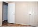Neutral hallway with doors and wood-look flooring at 199 Candy Ln, Canton, GA 30115