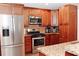 Well-equipped kitchen features stainless steel appliances and granite countertops at 199 Candy Ln, Canton, GA 30115