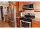 Spacious kitchen featuring stainless steel appliances and ample cabinet space at 199 Candy Ln, Canton, GA 30115