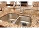 Close-up of kitchen sink featuring stainless steel faucet and granite countertops at 199 Candy Ln, Canton, GA 30115
