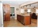 Eat-in kitchen with granite counters and stainless appliances, plus laundry area at 199 Candy Ln, Canton, GA 30115