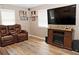 Cozy living room with recliners, entertainment center with fireplace, and bright natural light from windows at 199 Candy Ln, Canton, GA 30115