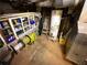 Basement utility area featuring hot water heater and storage shelves at 2413 N. Decatur Rd, Decatur, GA 30033