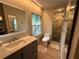Contemporary bathroom featuring a marble vanity, sleek fixtures, and a glass-enclosed shower at 2413 N. Decatur Rd, Decatur, GA 30033