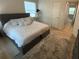 Bedroom featuring a comfortable queen-sized bed with soft bedding and a stylish area rug at 2413 N. Decatur Rd, Decatur, GA 30033