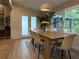 Bright dining room featuring a stylish table with seating for six and serene outdoor views at 2413 N. Decatur Rd, Decatur, GA 30033