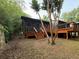 Exterior view of home showing a spacious deck and stairs leading to the backyard at 2413 N. Decatur Rd, Decatur, GA 30033