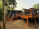 Exterior view of home showing a spacious deck and stairs leading to the backyard at 2413 N. Decatur Rd, Decatur, GA 30033