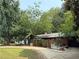 Charming brick home with a well-maintained lawn and a large, curved driveway at 2413 N. Decatur Rd, Decatur, GA 30033