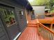 Home with two exterior doors accessing the spacious stained wood deck and peaceful views at 2413 N. Decatur Rd, Decatur, GA 30033