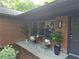 Charming covered front porch with chairs and plants creates an inviting entrance at 2413 N. Decatur Rd, Decatur, GA 30033