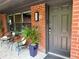 Inviting front porch with stylish seating and a well-maintained brick exterior at 2413 N. Decatur Rd, Decatur, GA 30033