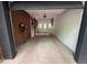 Open garage with brick walls, equipped with storage and electric vehicle charger at 2413 N. Decatur Rd, Decatur, GA 30033