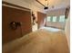Spacious garage with brick accent wall, bright lighting, and convenient equipment storage at 2413 N. Decatur Rd, Decatur, GA 30033