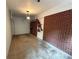 Spacious garage with brick wall, storage and a white door leading outside at 2413 N. Decatur Rd, Decatur, GA 30033