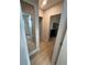 Hallway leading to bedroom with walk in closet and bath with light colored flooring and natural light at 2413 N. Decatur Rd, Decatur, GA 30033
