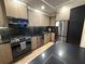 Contemporary kitchen with stainless steel appliances, sleek countertops, and modern cabinetry at 2413 N. Decatur Rd, Decatur, GA 30033