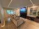 The spacious living room features modern lighting and is centered around a cozy fireplace at 2413 N. Decatur Rd, Decatur, GA 30033