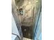 Contemporary shower featuring stylish marble tile, a black-tiled floor and a sleek glass door at 2413 N. Decatur Rd, Decatur, GA 30033