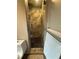 Sleek walk-in shower featuring elegant marble tile work, a modern shower head, and a glass door at 2413 N. Decatur Rd, Decatur, GA 30033