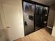 Large walk-in closet with stylish sliding doors, featuring ample storage space and wood flooring at 2413 N. Decatur Rd, Decatur, GA 30033