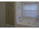 Bright bathroom featuring a soaking tub and a glass enclosed shower stall at 2955 Briaroak Dr, Duluth, GA 30096