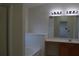 Bathroom featuring a bathtub, large mirror, vanity with sink and bright lighting at 2955 Briaroak Dr, Duluth, GA 30096