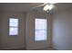 This bedroom has neutral walls, carpet, a ceiling fan and two windows for natural light at 2955 Briaroak Dr, Duluth, GA 30096