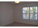 This bedroom has neutral walls and carpet with a window that provides natural light at 2955 Briaroak Dr, Duluth, GA 30096