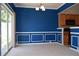 Dining area featuring blue walls, white trim, sliding glass doors and kitchen access at 2955 Briaroak Dr, Duluth, GA 30096