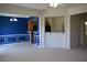 Open concept living space with neutral carpet, white trim and brightly painted blue accent wall at 2955 Briaroak Dr, Duluth, GA 30096
