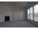 Living room featuring a fireplace, neutral carpet and multiple windows allowing for lots of light at 2955 Briaroak Dr, Duluth, GA 30096