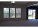 Living room featuring multiple windows allowing for plenty of natural light and access to the back yard at 2955 Briaroak Dr, Duluth, GA 30096