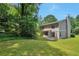 Green backyard with grass and a home with neutral siding at 4879 Ardsley Dr, Lithonia, GA 30038