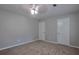 This bedroom features neutral walls, soft carpet, and dual closets at 4879 Ardsley Dr, Lithonia, GA 30038