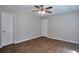 This bright bedroom offers neutral walls, a ceiling fan and a roomy closet at 4879 Ardsley Dr, Lithonia, GA 30038