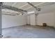 Empty garage with concrete floors and a white interior at 4879 Ardsley Dr, Lithonia, GA 30038