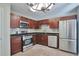 Updated kitchen with stainless steel appliances, granite countertops, and ample cabinet space at 4879 Ardsley Dr, Lithonia, GA 30038