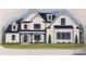 Charming modern farmhouse with white siding, black trim, covered porch and manicured lawn at 161 West Lake Blvd, Carrollton, GA 30116