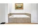 Relaxing built-in bathtub with tiled surround, offering a spa-like experience at 2216 Trammel Rd, Cumming, GA 30041
