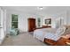 Inviting bedroom with French doors, natural light, and beautiful furnishings at 2216 Trammel Rd, Cumming, GA 30041