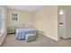 Cozy bedroom with a comfortable bed, soft carpet, and natural light from the window at 2216 Trammel Rd, Cumming, GA 30041