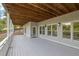 Large deck featuring a painted floor and ceiling, with a great view of the surrounding nature at 2216 Trammel Rd, Cumming, GA 30041