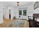 Inviting foyer with hardwood floors, white wainscoting, and decorative rug at 2216 Trammel Rd, Cumming, GA 30041