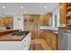 Bright, well-equipped kitchen with custom wood cabinets and a functional island space at 2216 Trammel Rd, Cumming, GA 30041