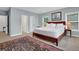 Spacious main bedroom features a large bed, natural light from the windows, and neutral wall paint at 2216 Trammel Rd, Cumming, GA 30041