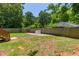 Large, grassy backyard surrounded by a wooden fence, perfect for outdoor activities and relaxation at 2405 Hillside Ave, Decatur, GA 30032