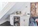 Charming bar featuring a beverage center, marble countertop and white cabinets at 2405 Hillside Ave, Decatur, GA 30032