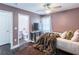 Bedroom includes an ensuite bathroom, television and beautiful fur rug at 2405 Hillside Ave, Decatur, GA 30032