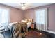 Cozy bedroom with natural light, wooden floors, and a decorative rug at 2405 Hillside Ave, Decatur, GA 30032